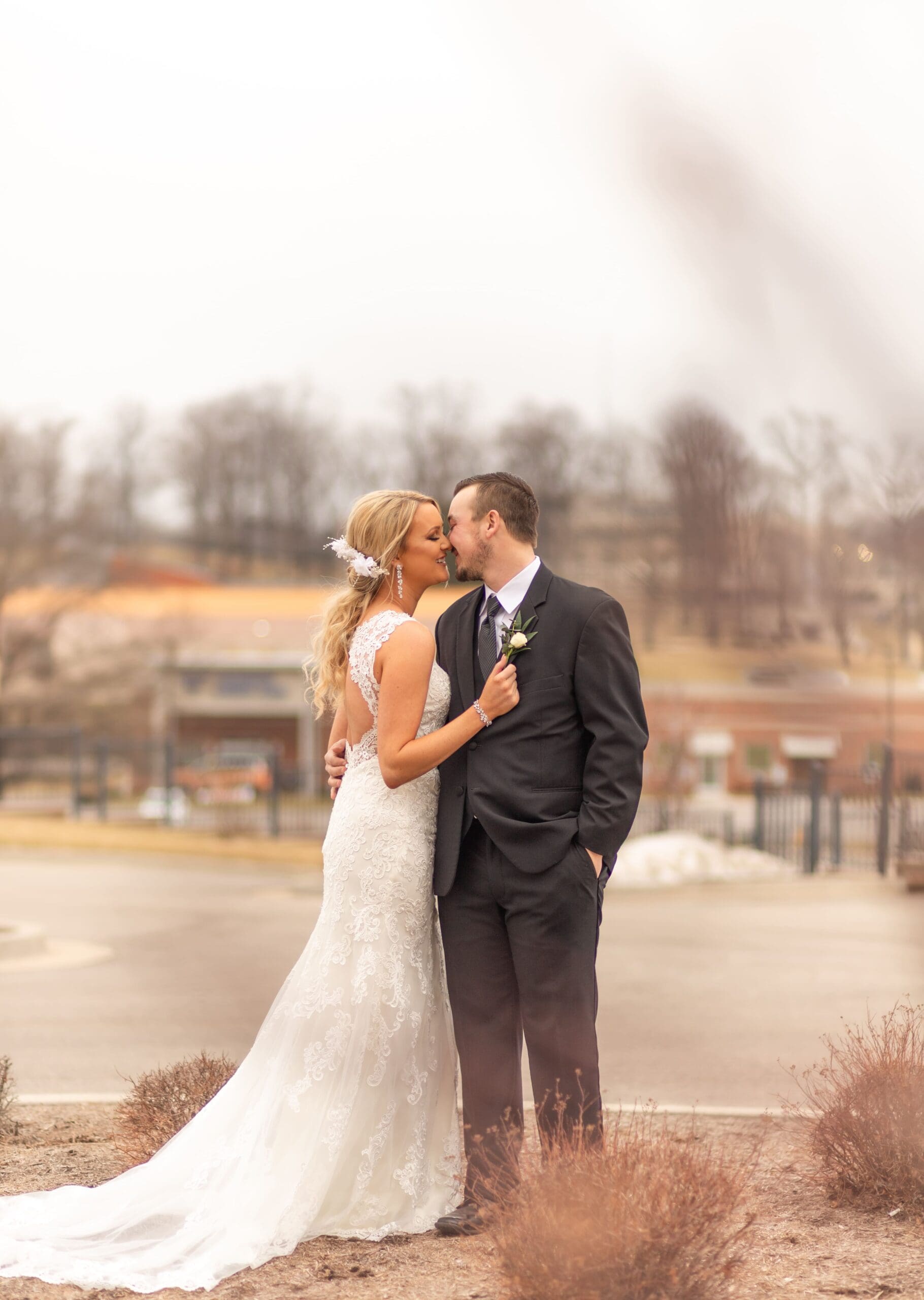 cape girardeau wedding, bride and groom, husband and wife, pond, wedding dress, black suit, kissing, southern illinois photographer